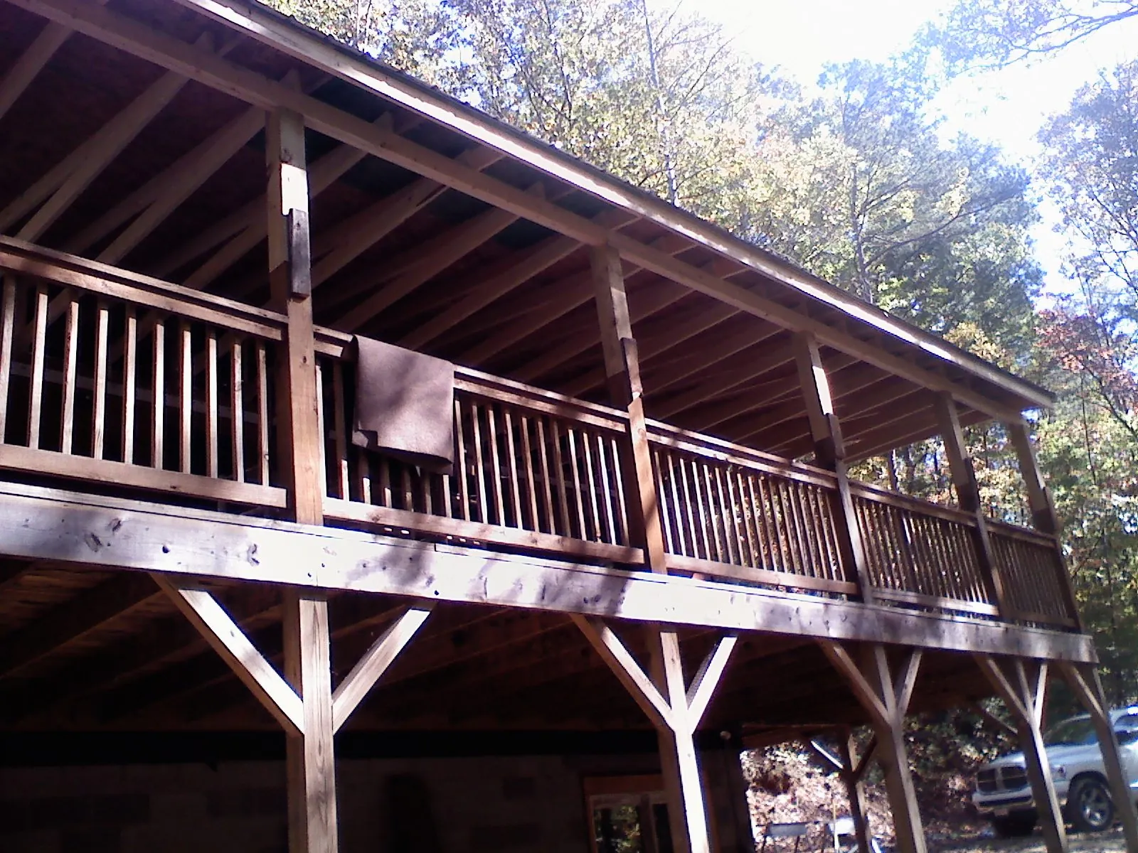 Timber framing under a new elevated porch and deck — Roof Leak Repair in East Kingston by Roofing Brothers